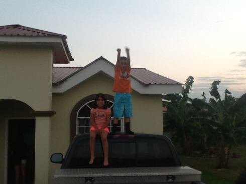 Lukas and Joyce playing on titi Clay's truck!
